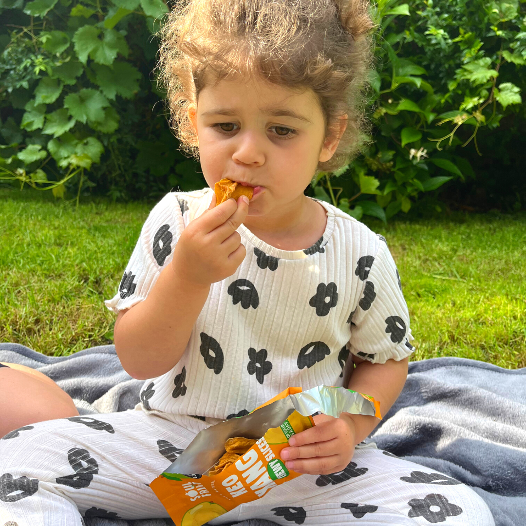 kid eating soft dried mango - kid healthy snack